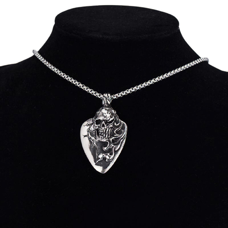 Stylish stainless steel unisex skull pendant on a silver chain, perfect for rock-inspired outfits.