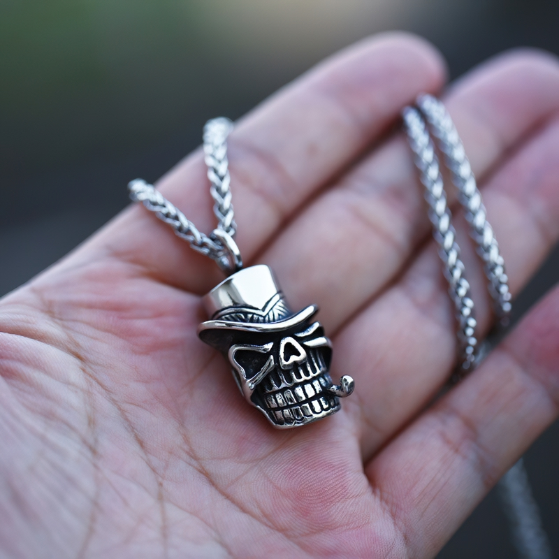 Unisex stainless steel skull pendant with hat, perfect for gothic fashion jewelry enthusiasts.