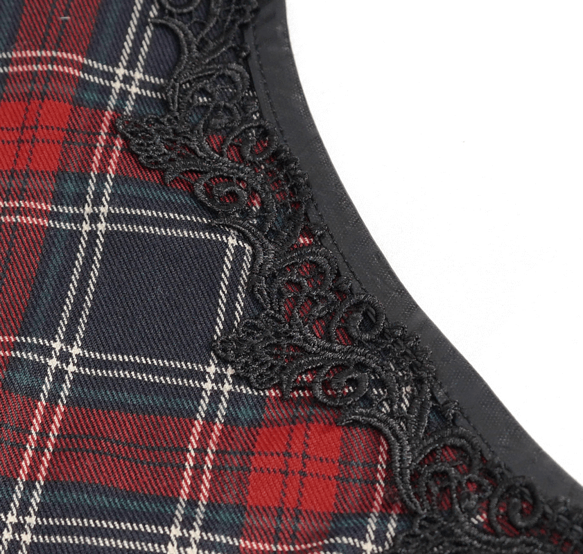 Close-up of gothic plaid dress fabric featuring ruffled lace hemline in black and red tones.