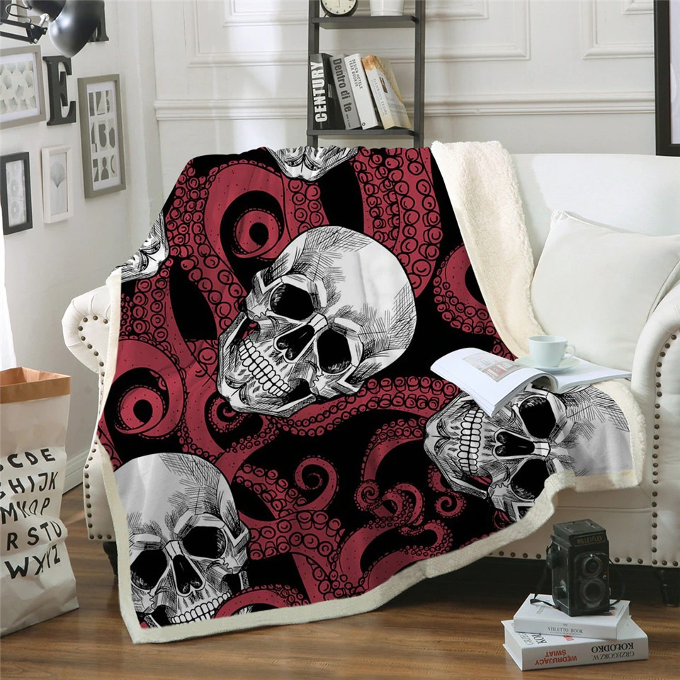 Gothic sherpa blanket featuring skulls and octopus design, perfect for cozy home decor on sofa.