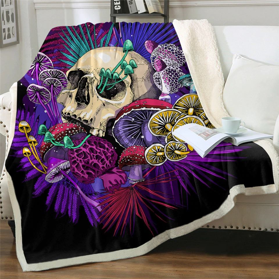 Gothic plush Sherpa blanket featuring a colorful skull and mushrooms, perfect for cozy evenings on the sofa.
