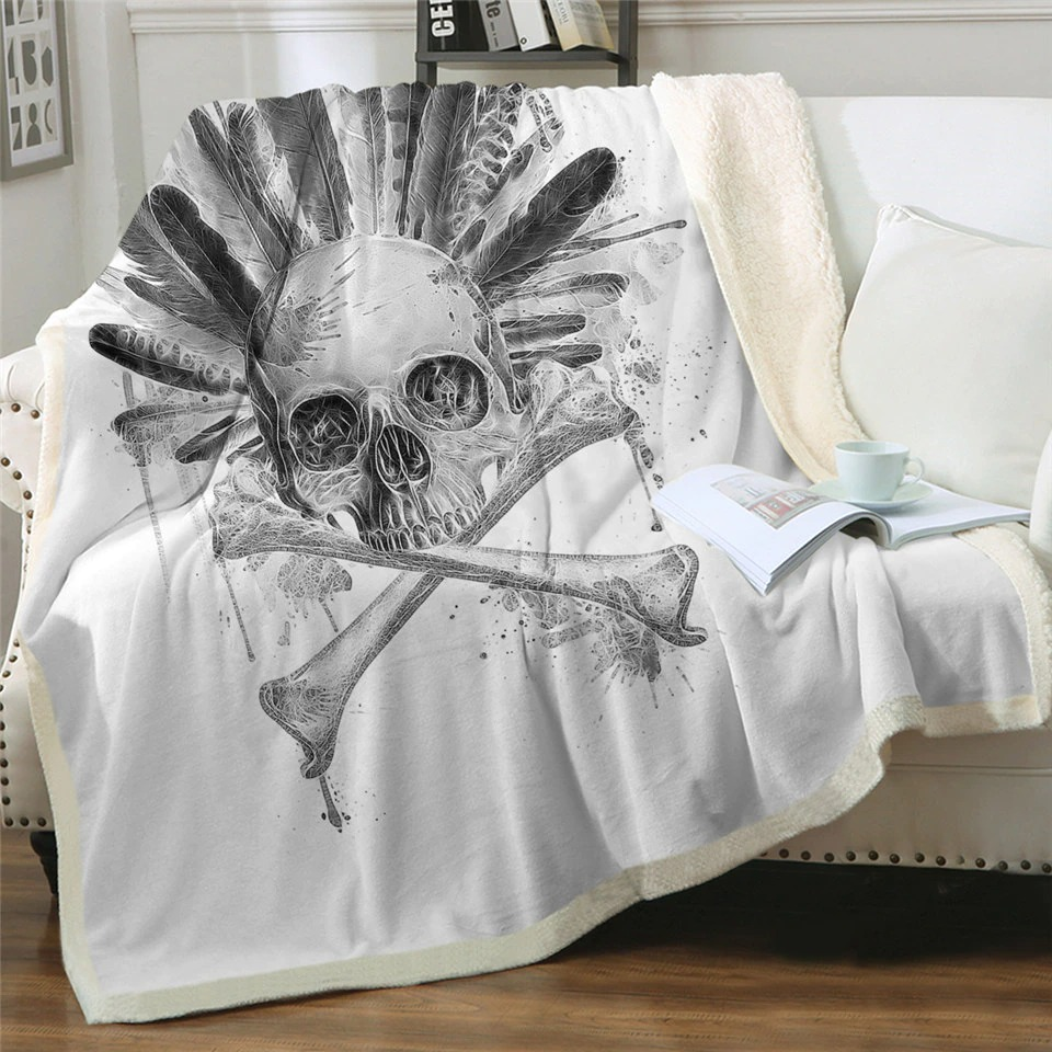 Gothic plush blanket featuring skull and feathers design, perfect for cozy winter evenings.
