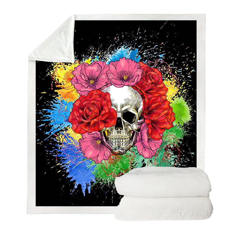 Gothic plush blanket with colorful skull and flower print, perfect for cozy decor on chilly nights.