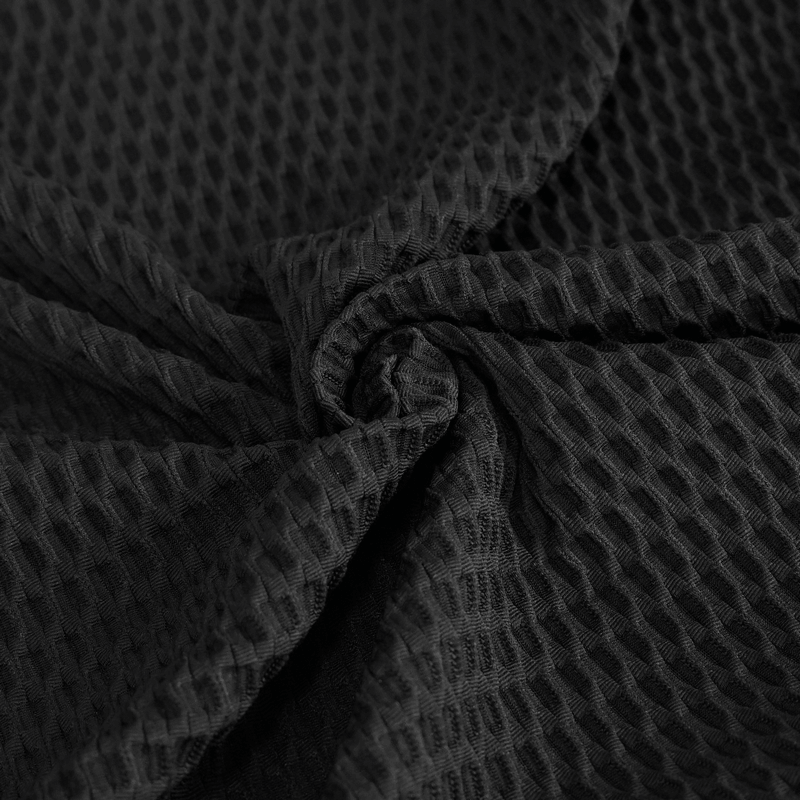 Close-up of black mesh fabric showcasing texture for gothic punk asymmetric sweatshirt design.