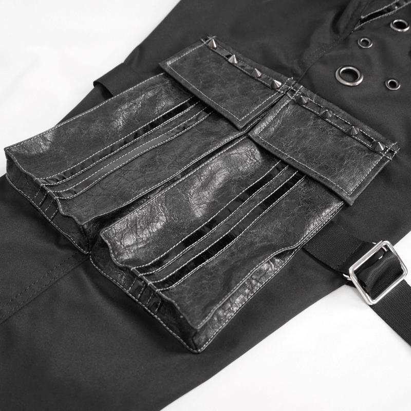 Close-up of gothic punk jogger pants featuring large pockets with studs and grommets for a stylish look.