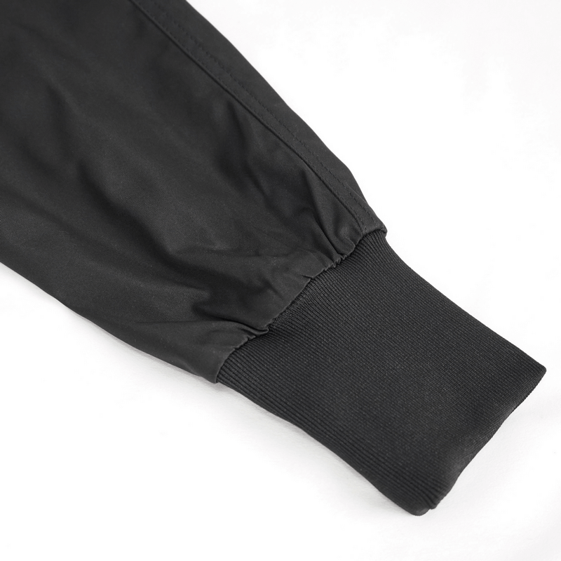 Close-up of elastic waistband cuff of gothic punk jogger pants in sleek black fabric.