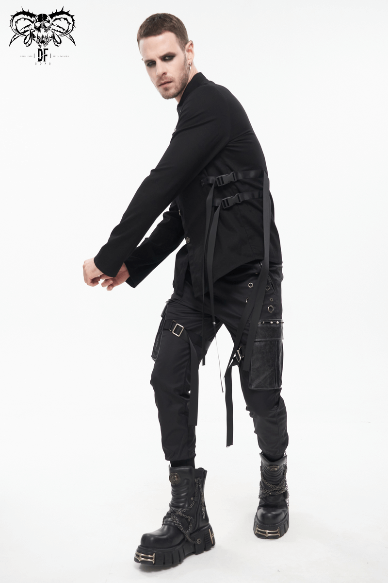 Trendy male model wearing black Gothic punk jogger pants with big pockets and stylish boots.