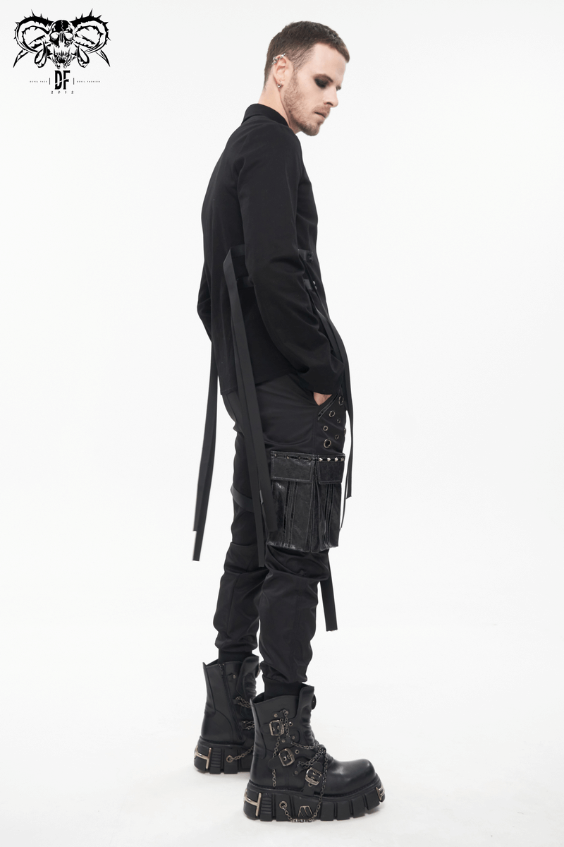 Stylish male model wearing black gothic punk jogger pants with big pockets and chunky boots, showcasing modern punk fashion.