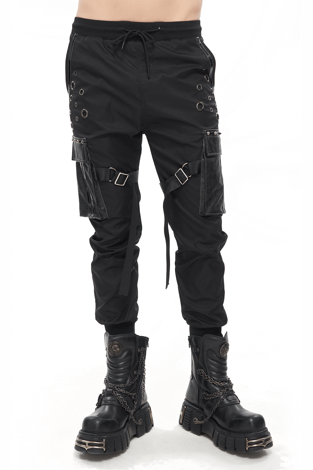 Gothic punk jogger pants with big pockets and grommets, paired with stylish black boots.