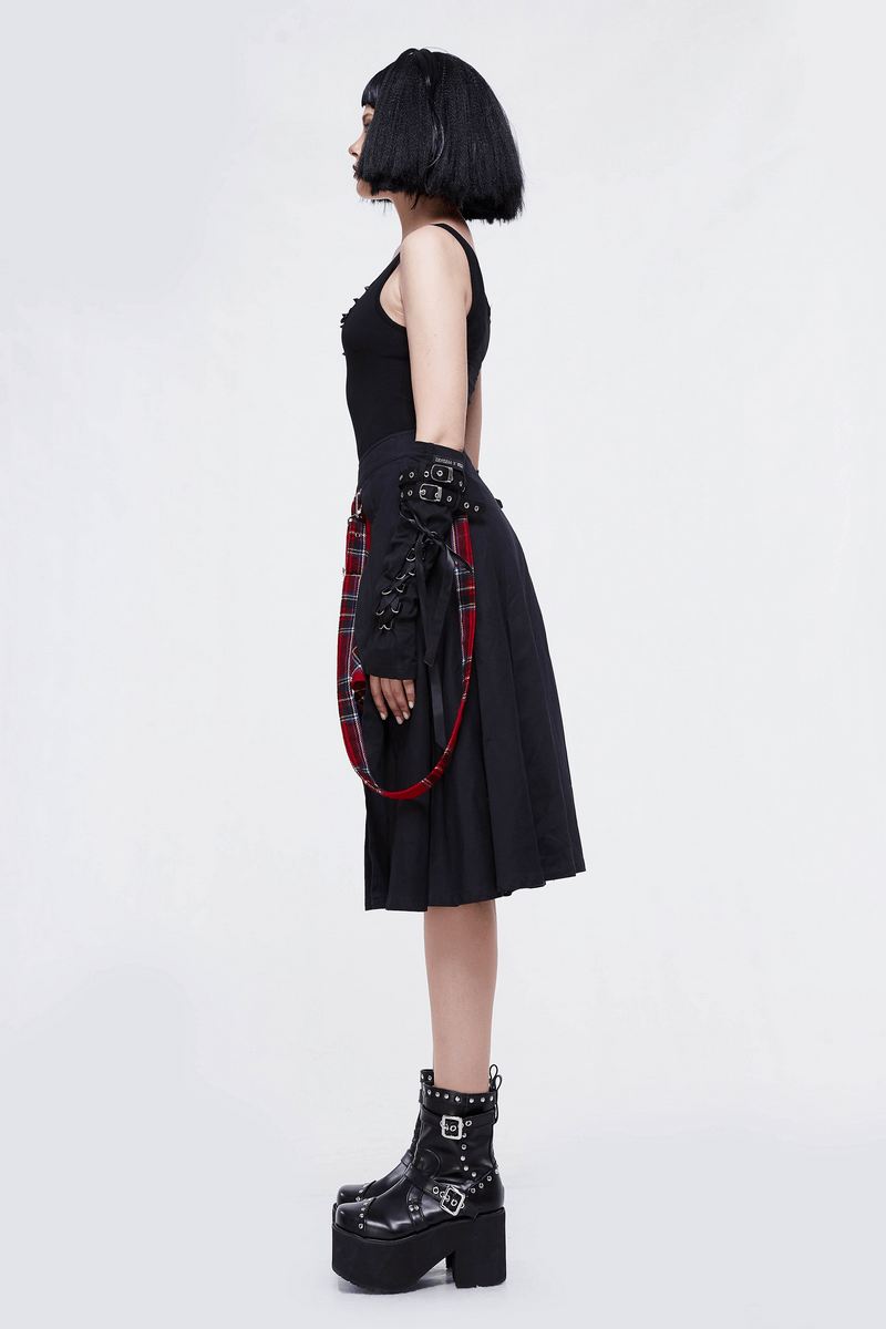 Side view of a model wearing a Gothic punk black half plaid skirt and edgy accessories, perfect for a stylish punk outfit.