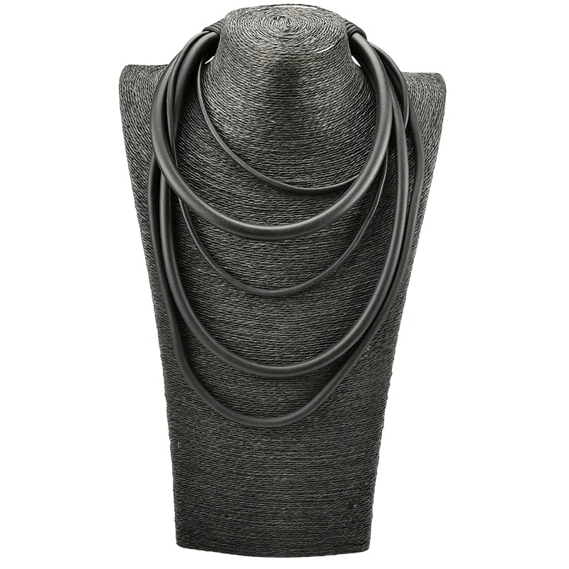 Handmade Gothic punk black rubber necklace displayed on a stylish black bust, perfect for adding flair to any outfit.