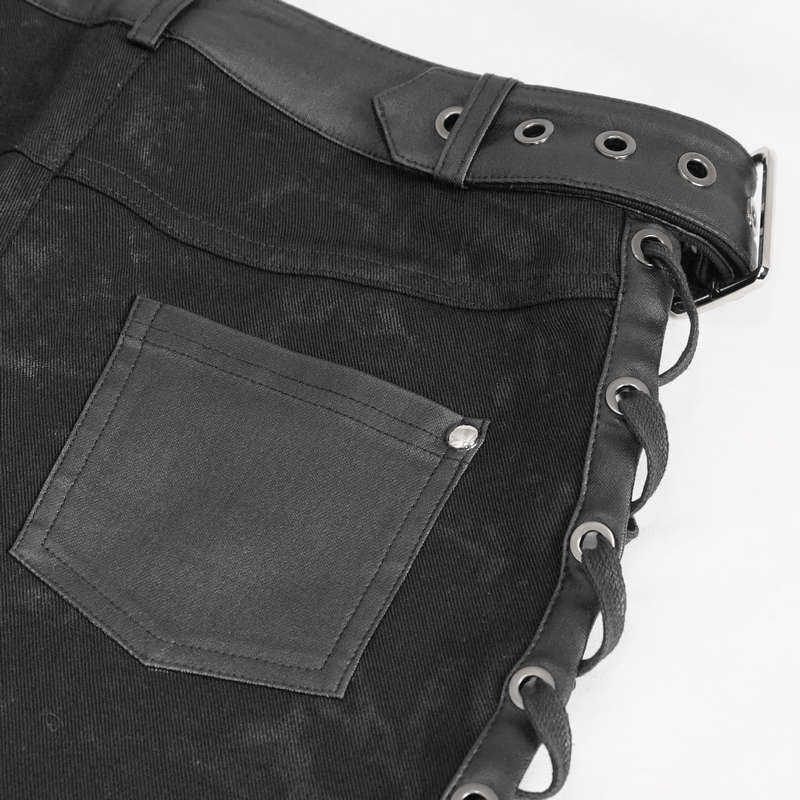 Close-up of gothic punk women's black shorts, featuring lace-up sides and stylish buckles, perfect for edgy fashion.