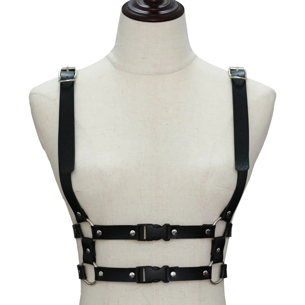 Gothic punk leather body harness for women, adjustable straps with zinc alloy details on a mannequin.