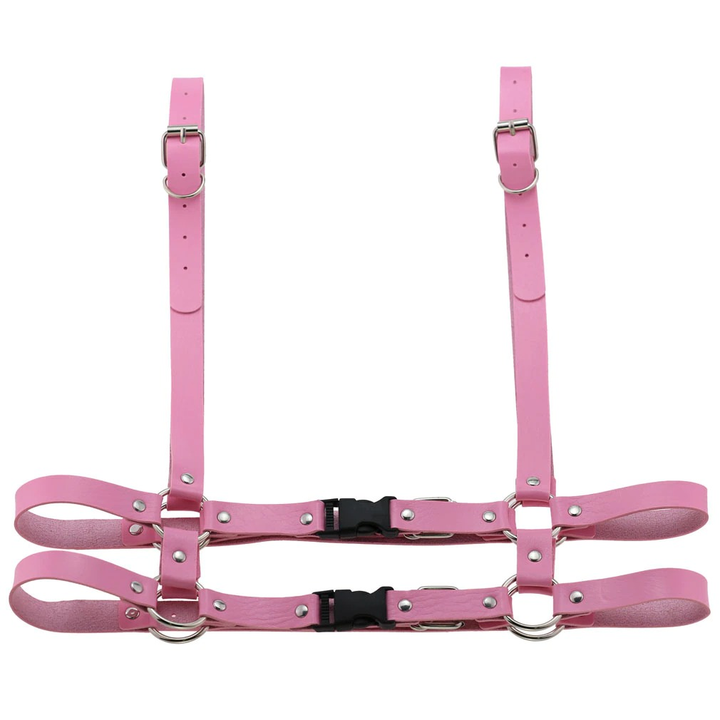 Gothic punk pink leather body harness for women with adjustable straps and zink alloy details.