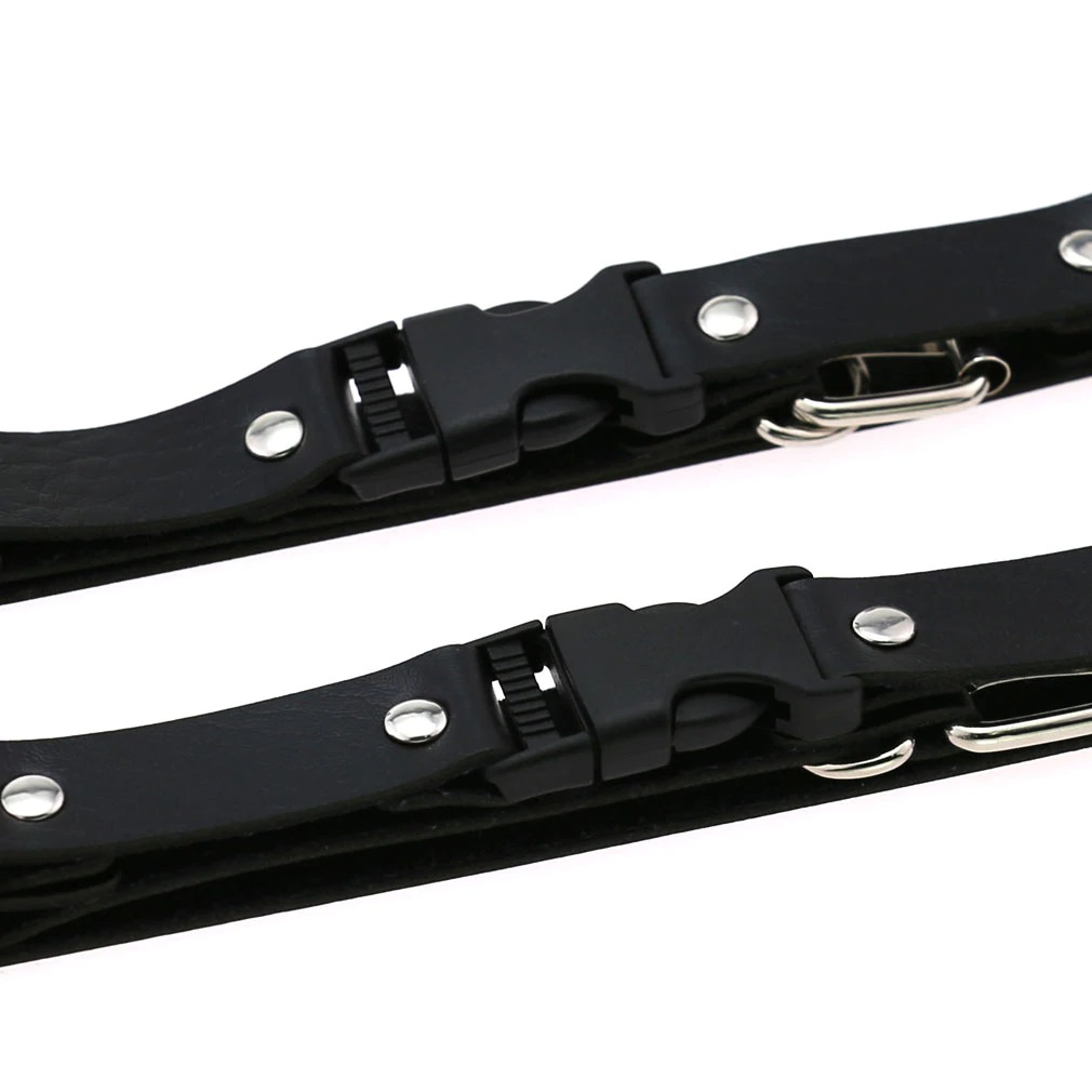 Close-up of adjustable black leather straps with metal clips for a Gothic punk body harness for women.