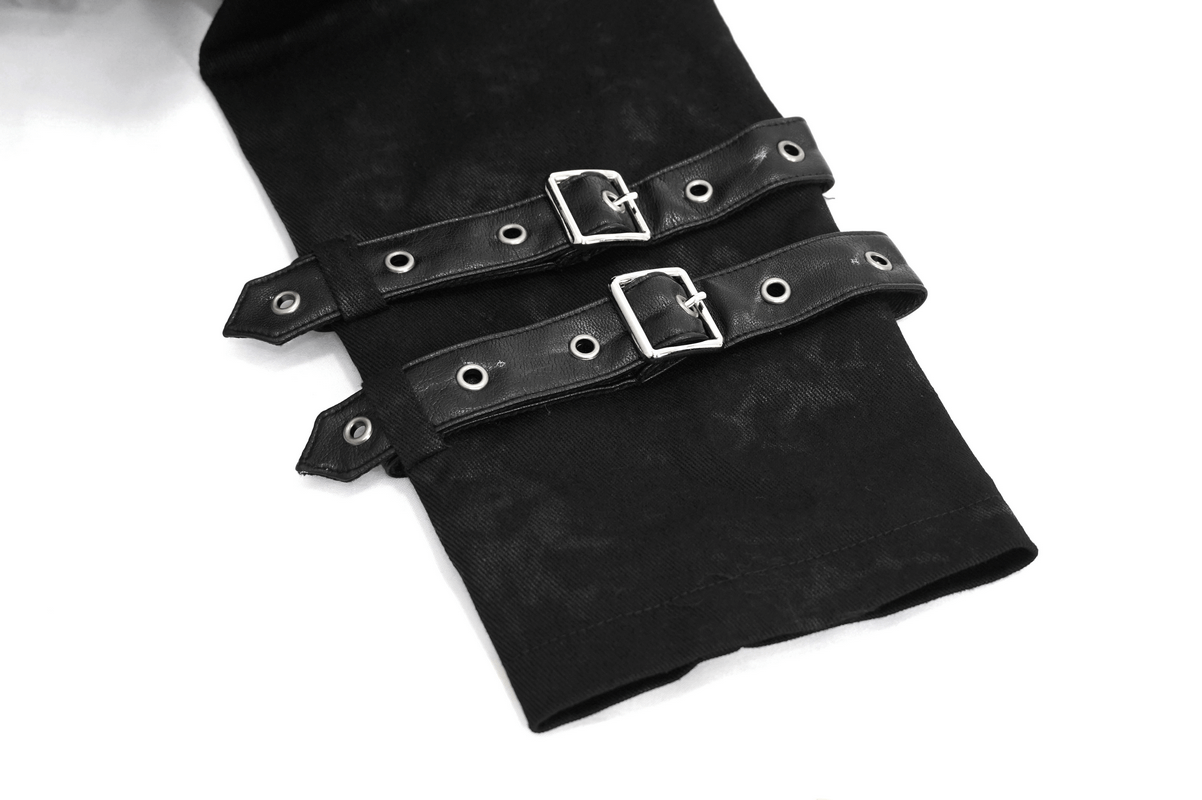 Detail of black trench coat straps with silver buckles and eyelets, showcasing gothic punk style.