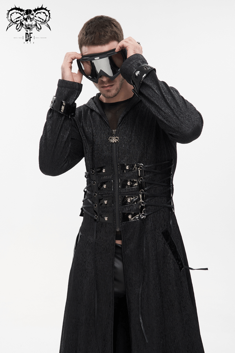 Gothic punk men's long hooded coat with lace-up accents, styled with goggles for a bold look.