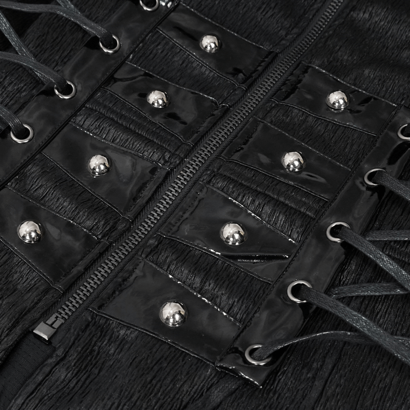 Close-up of black riveted zipper panels and lace-up accents on a Gothic punk men's coat.