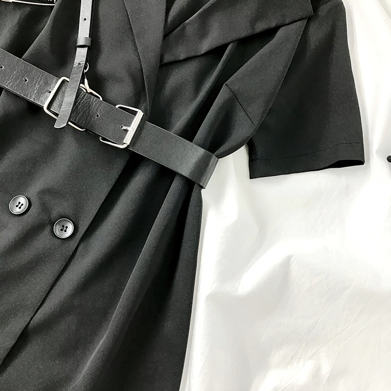 Close-up of a gothic punk mini dress with a blazer cut, featuring a stylish belt and buttons, perfect for edgy fashion.