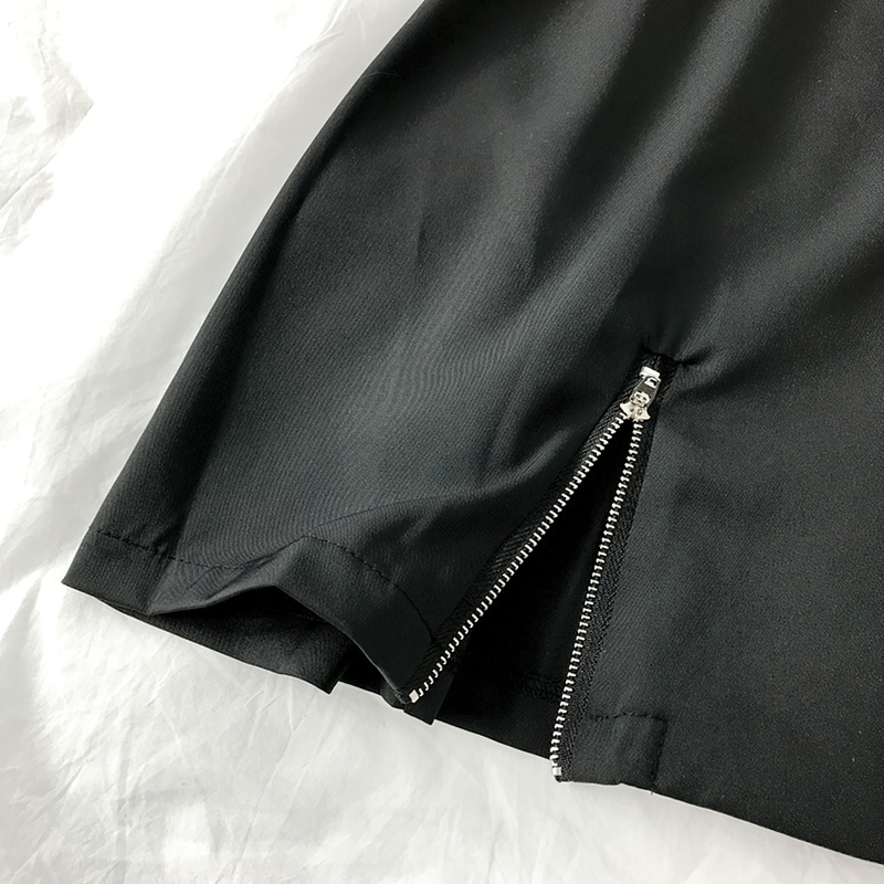Close-up of the stylish side zip detailing on a black gothic punk short sleeve blazer dress.