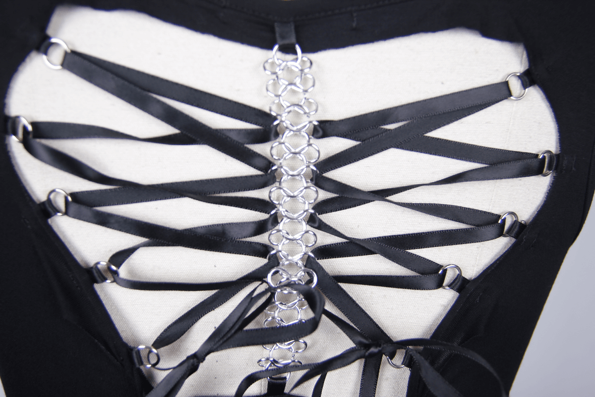Close-up of gothic punk tank top back lacing detail with heart-shaped design and silver accents.