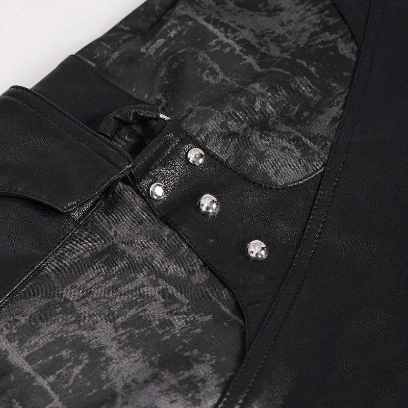 Close-up of punk style men's black trousers featuring a stylish pocket insert and decorative studs.