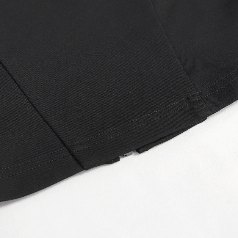 Detail of black crop top showing circled pentagram zipper and stitching for a trendy punk look.