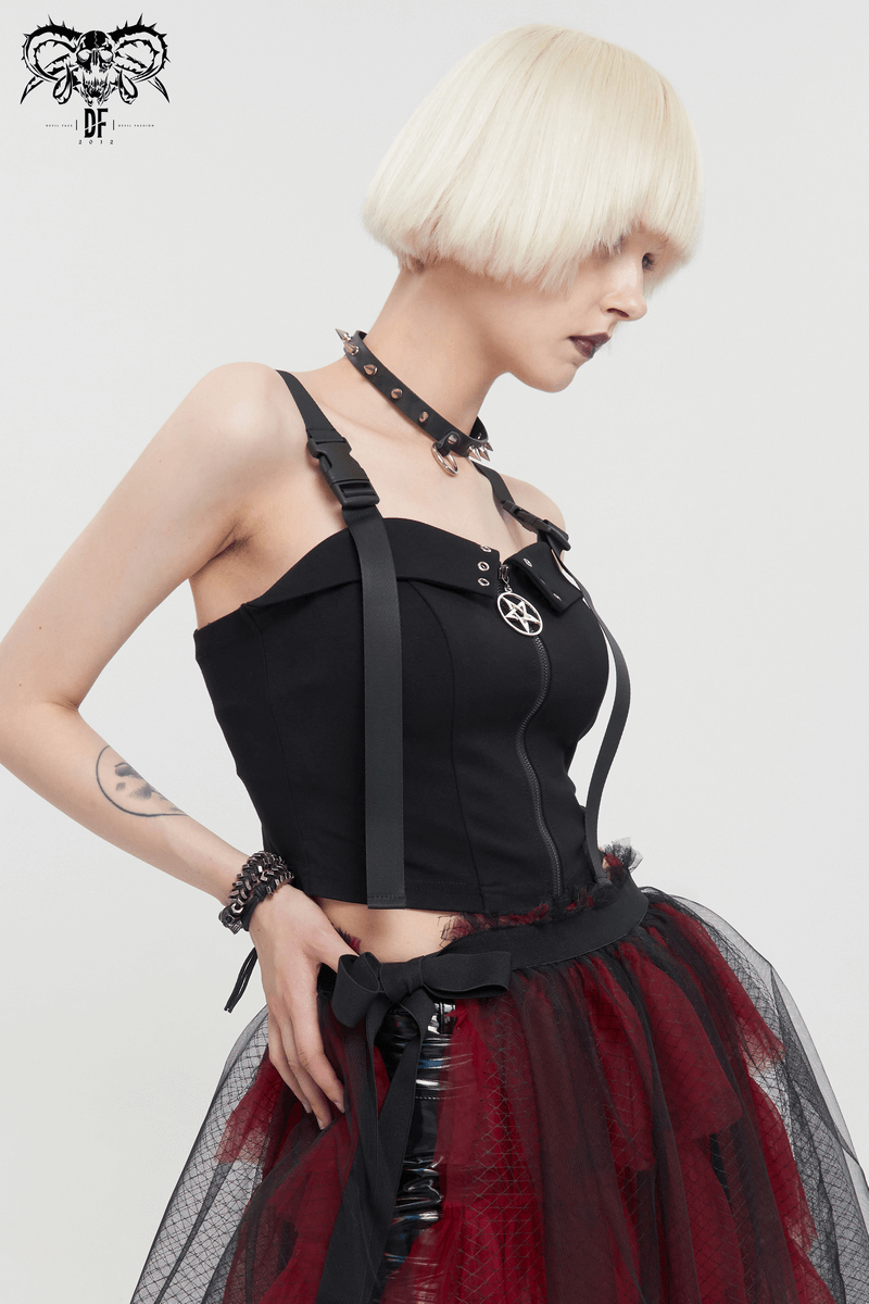 Woman wearing a gothic punk black crop top featuring pentagram zipper and adjustable buckle straps.