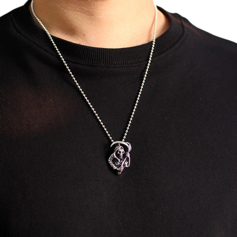 Unisex Gothic Reaper pendant in sterling silver featured on a model's neck, perfect for trendy outfits.