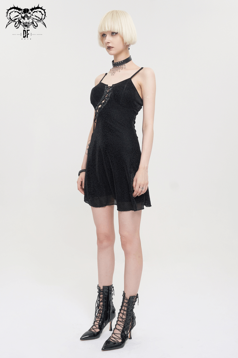 Gothic sexy short black dress with hollow out lace-up detail and adjustable shoulder straps on fashion model.
