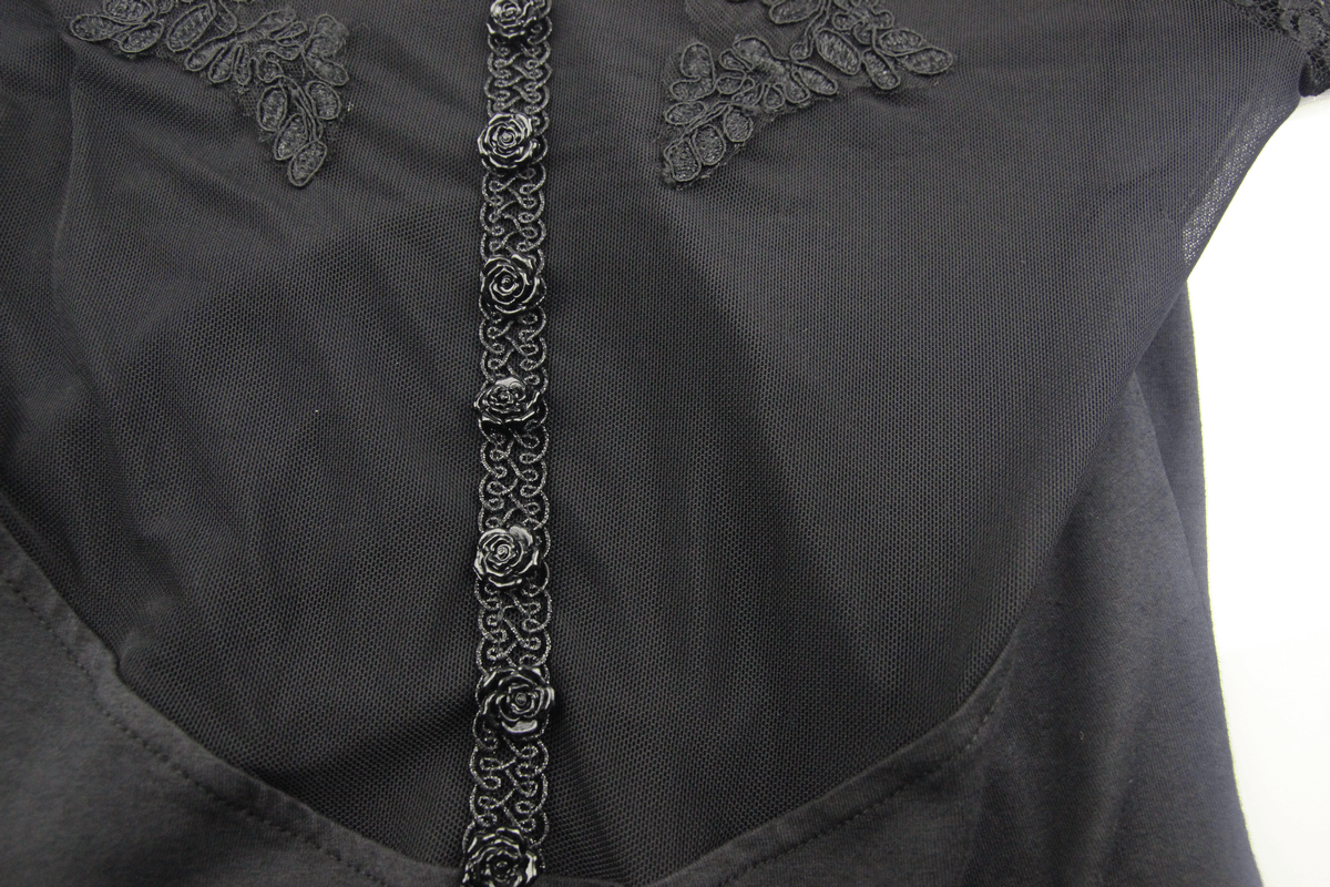 Close-up of gothic dress featuring intricate lace details and elegant black rose accents on the neckline.