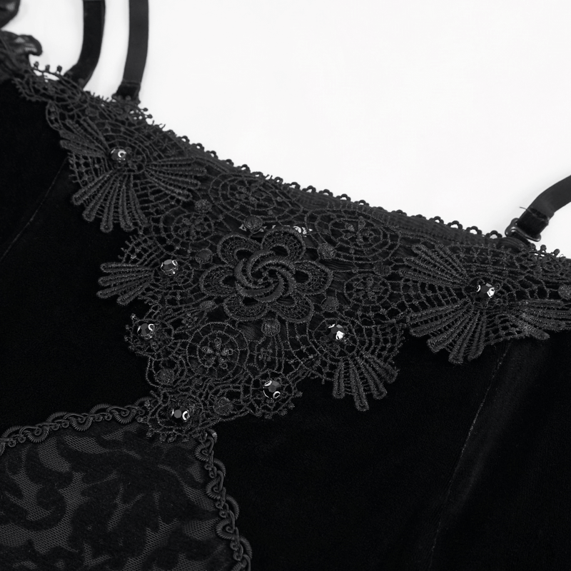 Close-up of elegant black lace detailing on gothic off-the-shoulder dress, showcasing intricate floral embroidery and shine.