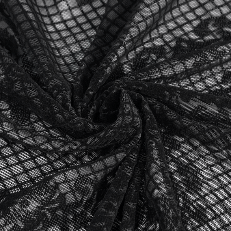 Close-up of elegant black lace fabric with intricate patterns, perfect for gothic-style dresses.