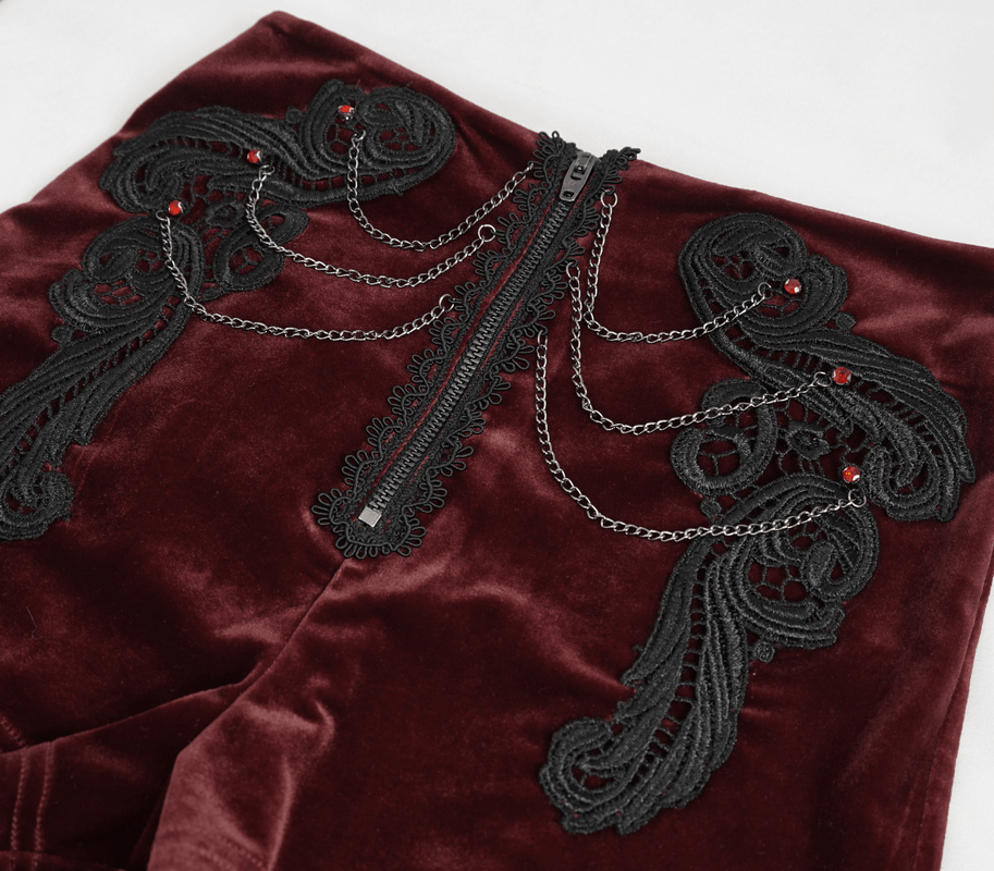 Gothic velvet shorts with intricate lace appliqué and chain detailing, perfect for stylish vintage outfits.