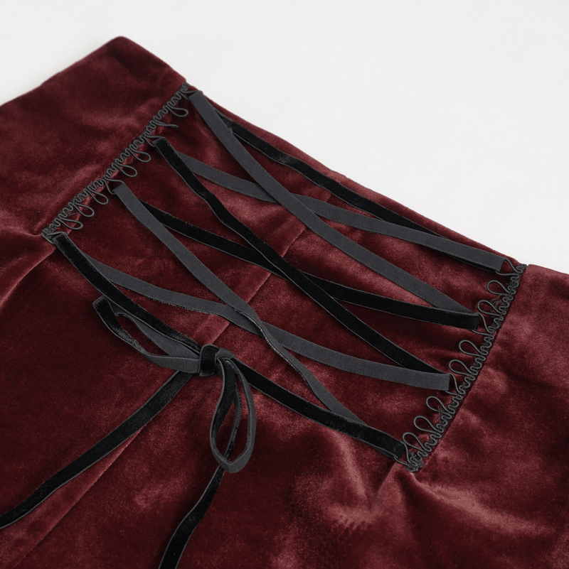 Close-up of gothic velvet shorts featuring stylish lace-up detailing and black ribbon ties.
