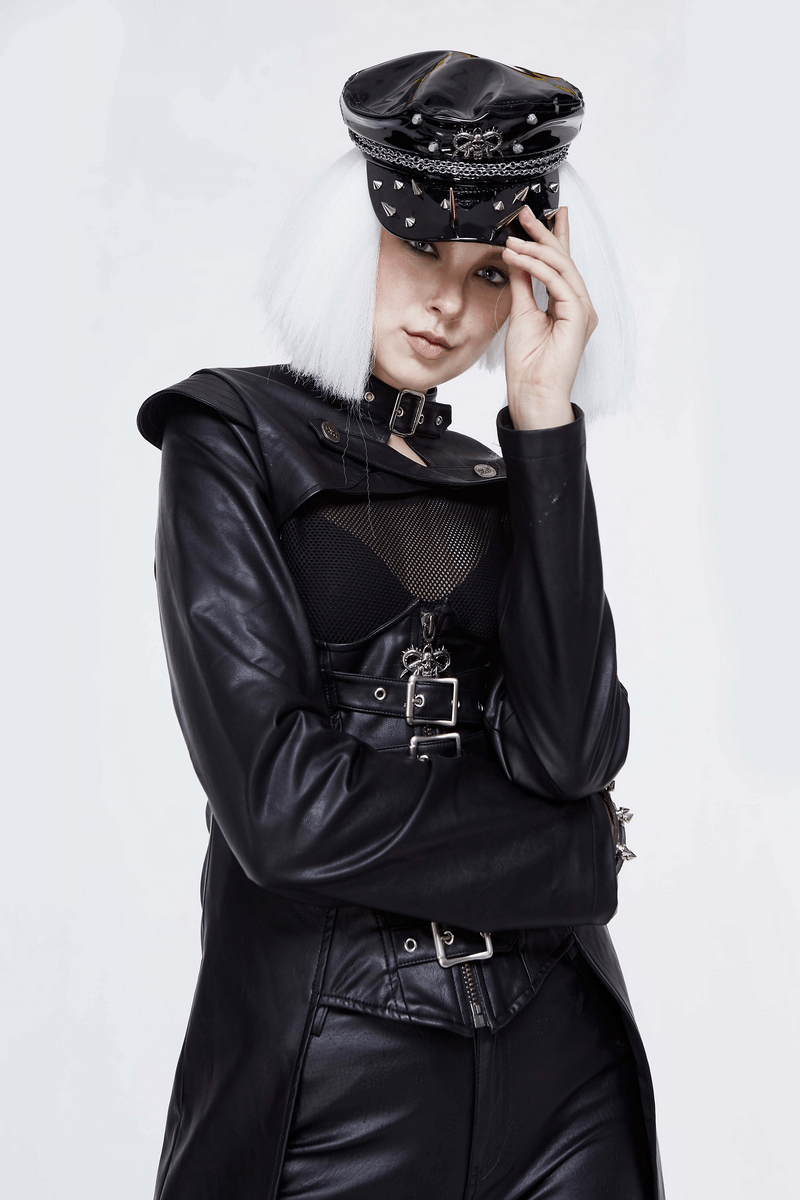 Gothic shiny vinyl military cap with spikes, worn by model in stylish black leather outfit.