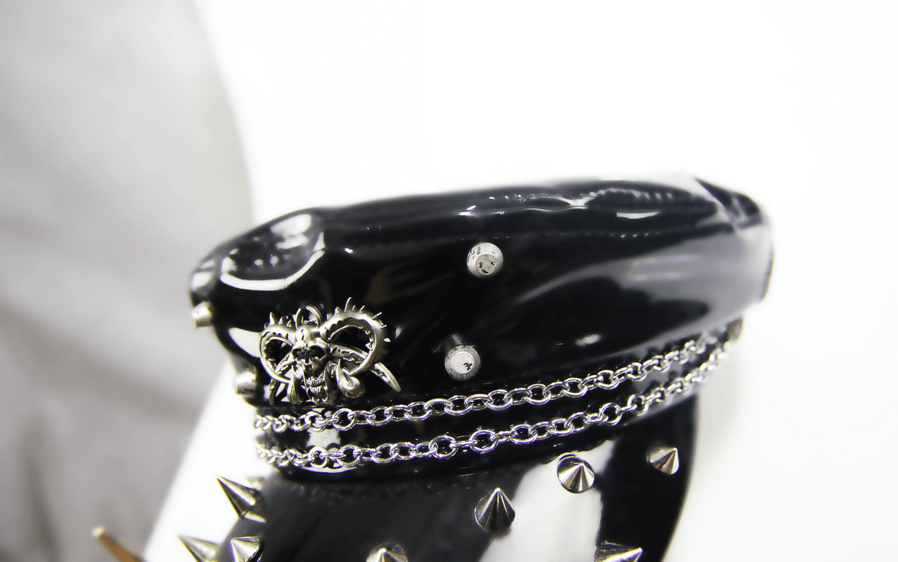 Gothic shiny vinyl military cap for women, featuring spikes and a stylish chain accent in black.