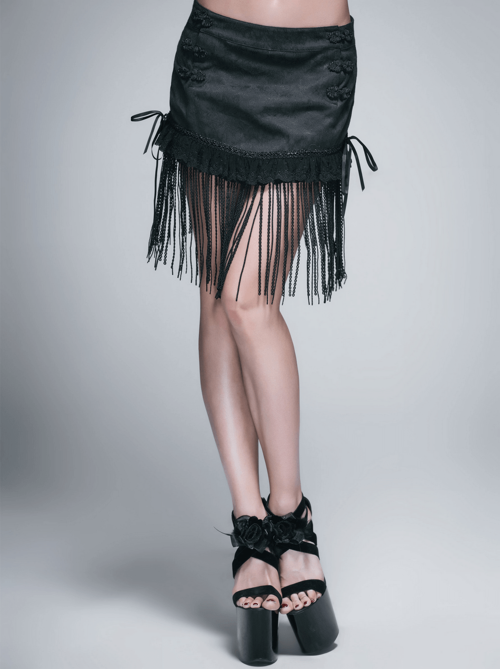 Gothic short skirt with lace tassels and ruffles, showcasing a stylish cut and trendy fringe details.