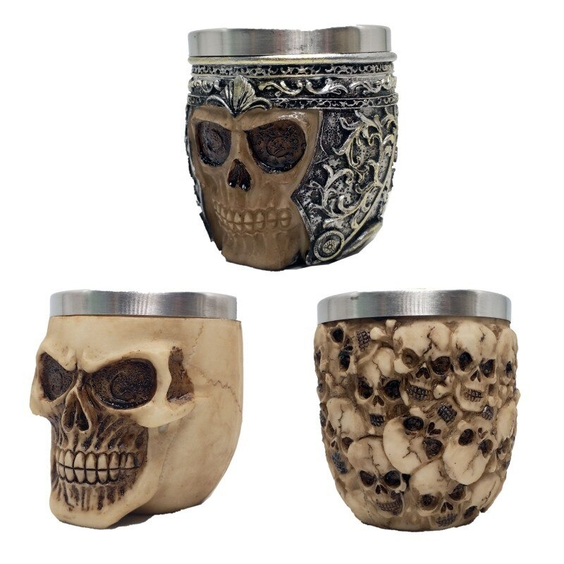 Gothic stainless steel skull shot glasses with intricate designs, perfect for drinkware or home decor.