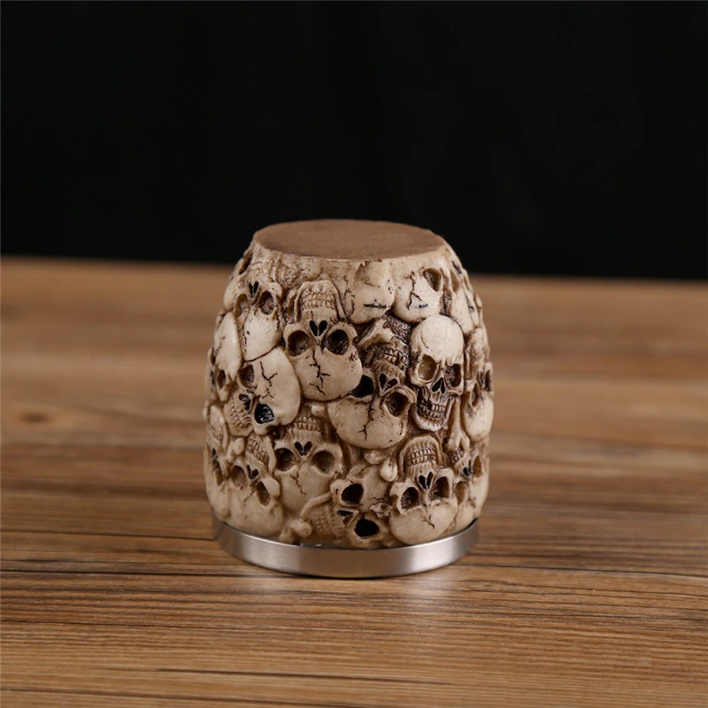 Gothic stainless steel skull shot glass with intricate skull details, perfect for drinkware or as a unique decoration.