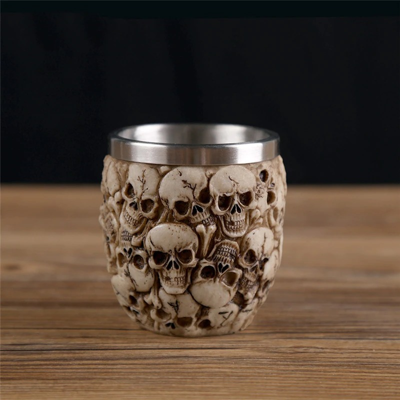 Gothic stainless steel skull shot glass with detailed skull design, perfect for alternative drinkware lovers.