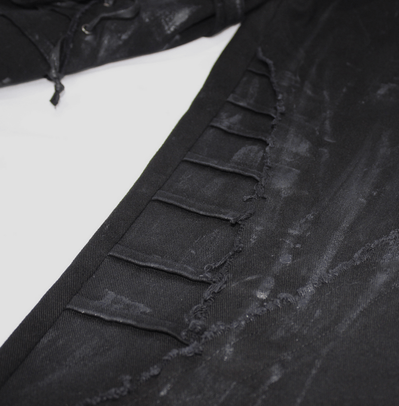 Close-up of gothic slim fit black pants showcasing lace-up detail and stylish fabric texture.