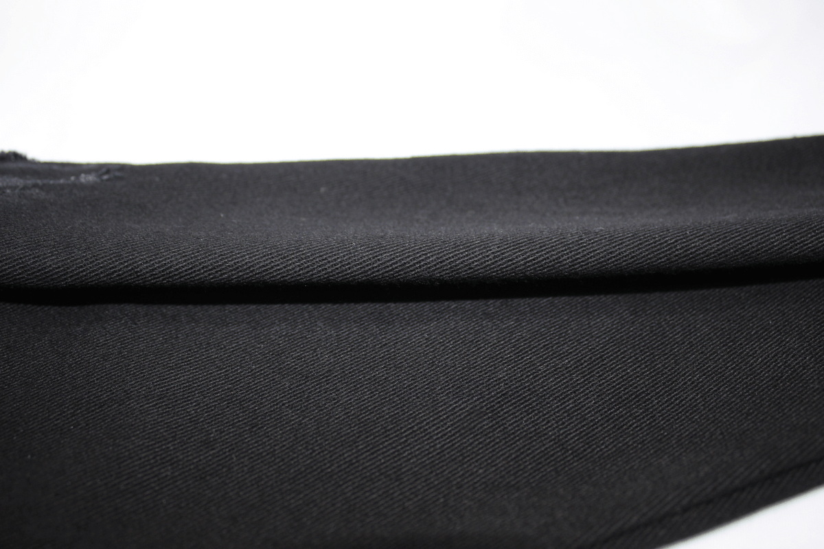 Close-up of Gothic slim fit pants showcasing sleek black fabric and stylish details.