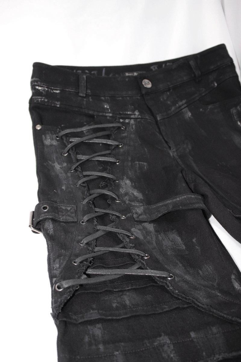 Gothic slim fit black pants with lace-up detail on the right leg and belt buckle.