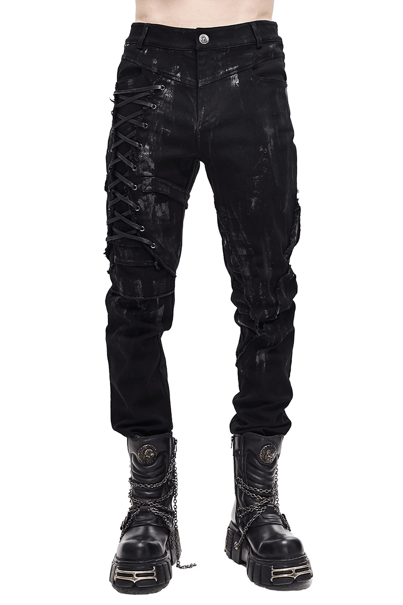 Gothic slim fit black pants with lace-up detail on right leg, styled with chunky black boots.