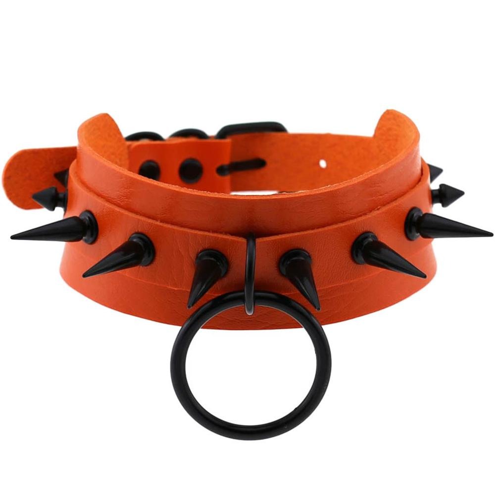Gothic spiked choker necklace in orange leather with black spikes and ring, perfect for rock outfits and unisex rave wear.