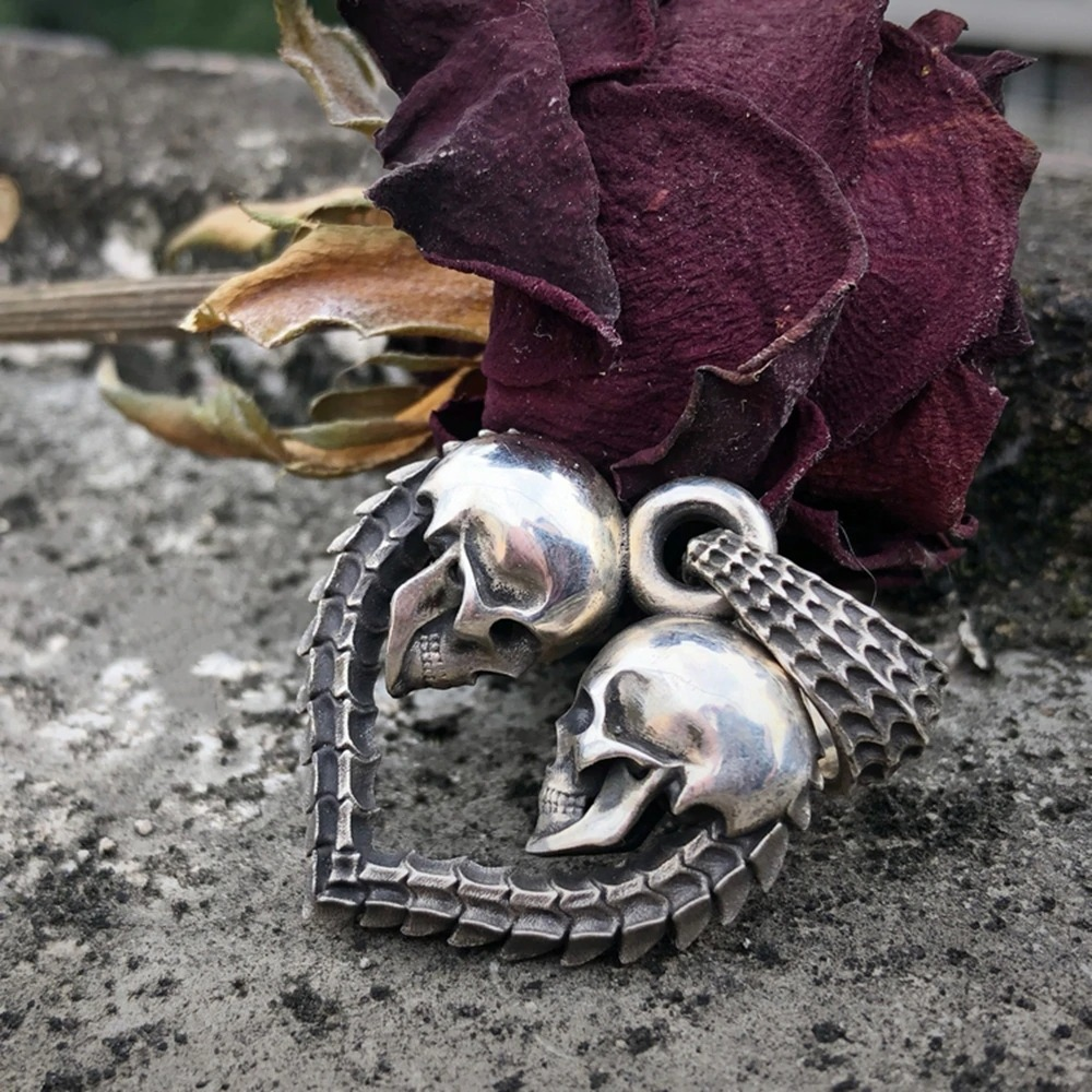 Gothic stainless steel double skull heart necklace pendant with rose backdrop for bikers and unisex jewelry lovers.