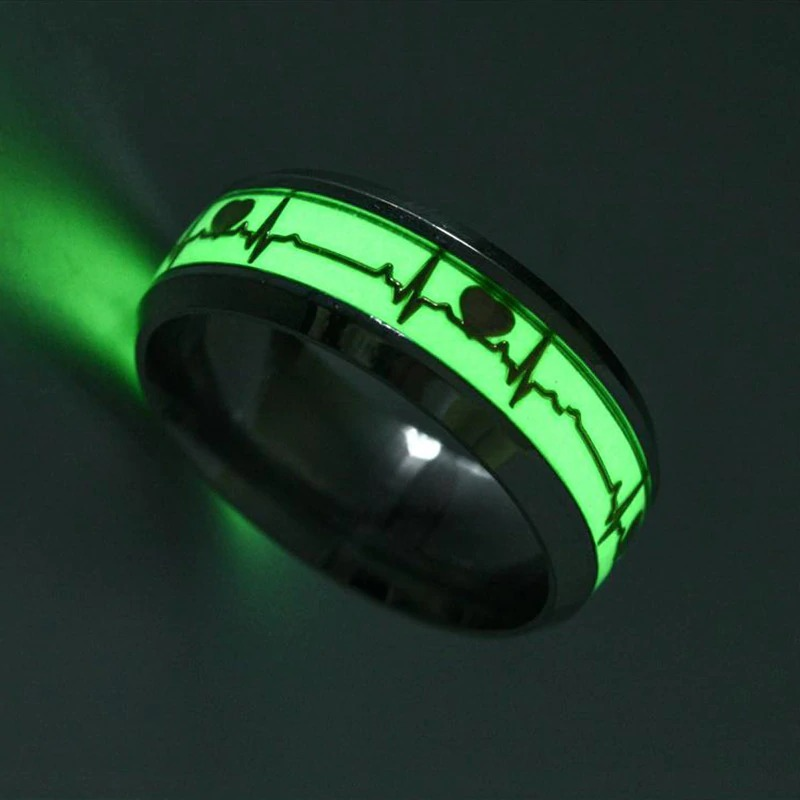 Gothic Heart Cardio Line Luminous Ring glowing in green on a dark background, featuring a unique design on stainless steel.