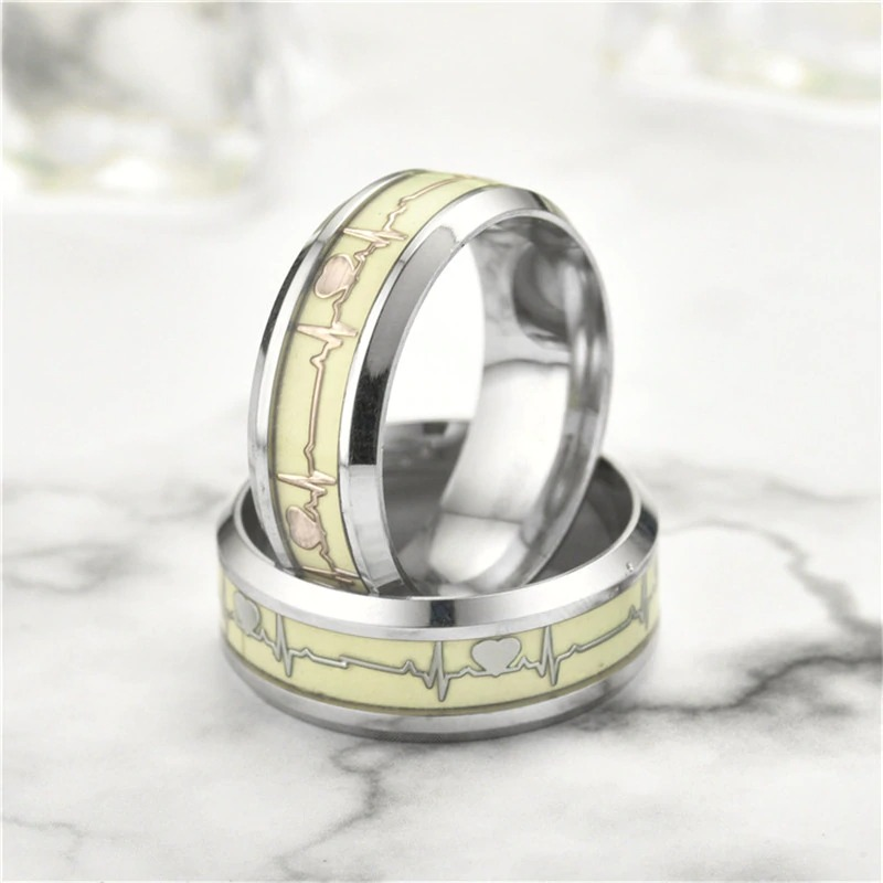 Gothic stainless steel heart cardio line luminous ring with green glow, unisex jewelry showcasing a unique design.