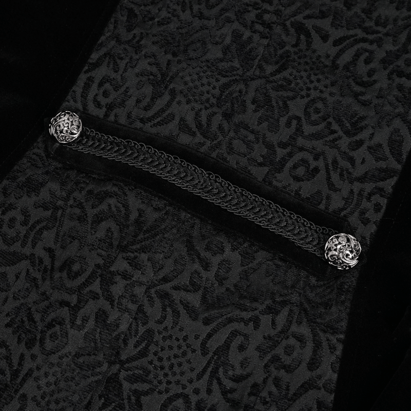 Close-up of gothic patterned black tailcoat with decorative buttons and zipper details.